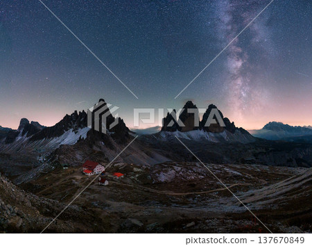 Scenic view of Milky Way over Tre Cime di Lavaredo mountain and Rifugio Locatelli at night in Dolomites, Italy Scenic view of Milky Way over Tre Cime di Lavaredo mountain and Rifugio Locatelli at night in Dolomites, Italy 137670849