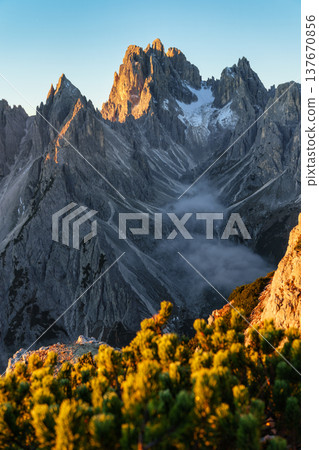 Alpine landscape of sunrise over Cadini di Misurina with rugged mountain range during autumn in Dolomites, Italy 137670856