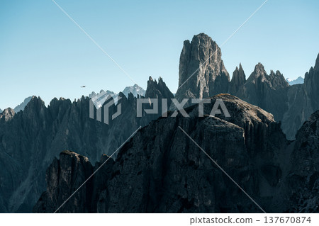 Alpine landscape of rugged Tre Cime mountain peak in Dolomites, Italy Alpine landscape of rugged Tre Cime mountain peak in Dolomites, Italy 137670874
