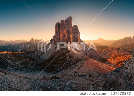 Scenic sunset view of Tre Cime di Lavaredo mountain peaks on Forcella Lavaredo viewpoint at Dolomites, Italy Scenic sunset view of Tre Cime di Lavaredo mountain peaks on Forcella Lavaredo viewpoint at Dolomites, Italy 137670877
