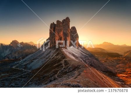 Scenic view of sunset over Tre Cime di Lavaredo mountain peaks on Forcella Lavaredo viewpoint at Dolomites, Italy 137670878