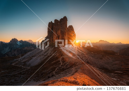 Scenic view of sunset over Tre Cime di Lavaredo mountain peaks on Forcella Lavaredo viewpoint at Dolomites, Italy 137670881