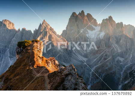 Alpine landscape of Cadini di Misurina with rugged mountain range during sunset in Dolomites, Italy Alpine landscape of Cadini di Misurina with rugged mountain range during sunset in Dolomites, Italy 137670892