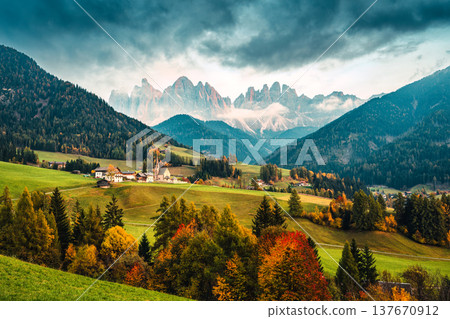 Autumn landscape of Santa Maddalena village with Odle mountain range in Val di Funes, Dolomites, Italy Autumn landscape of Santa Maddalena village with Odle mountain range in Val di Funes, Dolomites, Italy 137670912