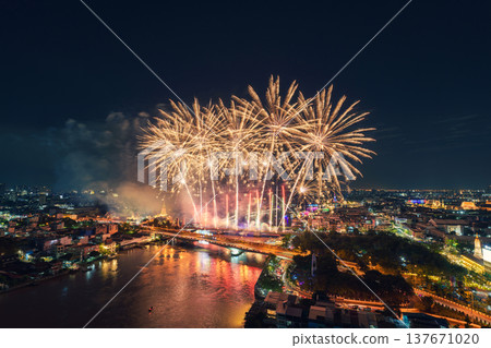 Spectacular fireworks display above Chao Phraya River, Memorial Bridge and Bangkok city at night Spectacular fireworks display above Chao Phraya River, Memorial Bridge and Bangkok city at night 137671020