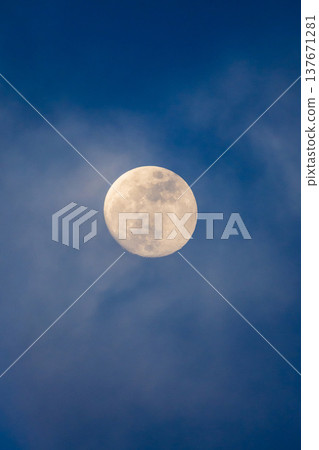 Full moon in dark blue cloudy sky, abstract night real sky astro photography Full moon in dark blue cloudy sky, abstract night real sky astro photography 137671281