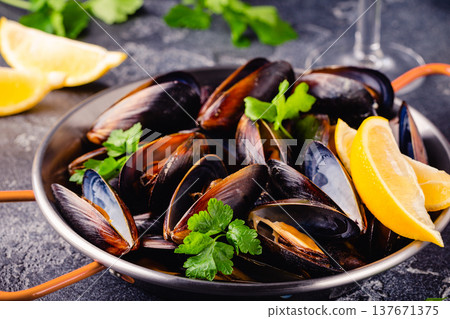 Delicious seafood mussels with sauce and parsley. Delicious seafood mussels with sauce and parsley. 137671375