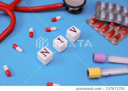 Colorful representation of health care tools and medication related to the NIV technique displayed on a vivid blue background 137671791