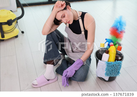 Cleaning day brings mixed emotions while preparing supplies and gathering thoughts in a bright modern home Cleaning day brings mixed emotions while preparing supplies and gathering thoughts in a bright modern home 137671839