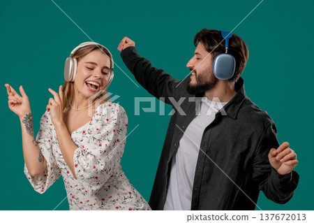 Positive Couple Dancing In Headphones. Green Studio. Favorite Music, Dance 137672013