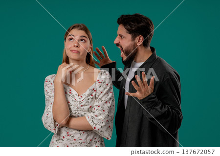 Angry Man Quarrels Wife Or Girlfriend On Green. Couple Relationships, Quarrel Angry Man Quarrels Wife Or Girlfriend On Green. Couple Relationships, Quarrel 137672057