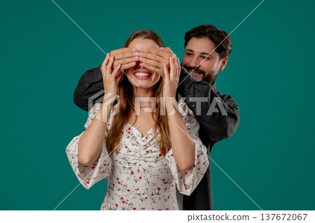 Handsome Man Closes Eyes Of His Beloved Girlfriend Before Surprise. Happy Couple Handsome Man Closes Eyes Of His Beloved Girlfriend Before Surprise. Happy Couple 137672067