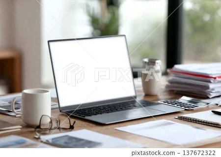 Blank laptop screen mockup on wooden workspace, featuring office accessories like scattered documents, coffee mug, pen, reading glasses, calculator, representing remote work environment Blank laptop screen mockup on wooden workspace, featuring office accessories like scattered documents, coffee mug, pen, reading glasses, calculator, representing remote work environment 137672322
