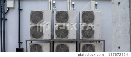 Air conditioner compressor installed in old building.  137672324