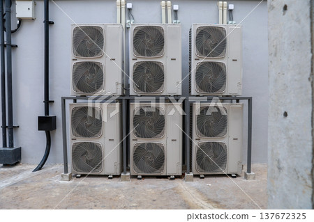 Air conditioner compressor installed in old building.  137672325