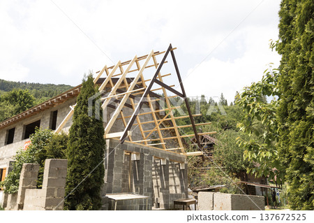 Wooden construction attached to a house in the mountains showing building extension and rural architecture Wooden construction attached to a house in the mountains showing building extension and rural architecture 137672525