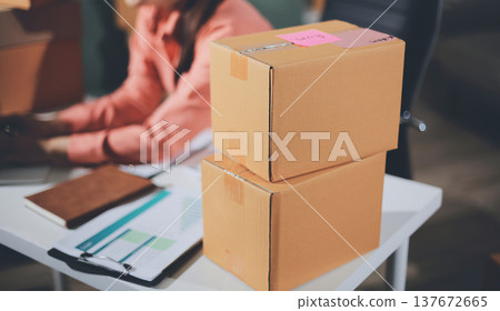 Startup, small business, SME owner check online orders. data logging Business growth, selling products, working with boxes. freelance work at home office online sme business small organization 137672665