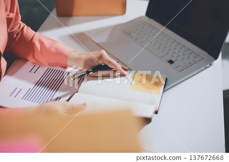 Startup, small business, SME owner check online orders. data logging Business growth, selling products, working with boxes. freelance work at home office online sme business small organization 137672668