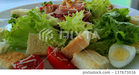 Detailed shot of ingredients of served Caesar salad 137673016
