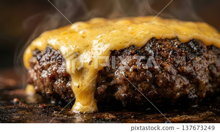 Extreme Macro of Melted Cheddar Cheese Dripping Down Burger Patty 137673249