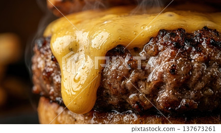 Extreme Macro of Melted Cheddar Cheese Dripping Down Burger Patty 137673261