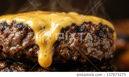 Extreme Macro of Melted Cheddar Cheese Dripping Down Burger Patty 137673275