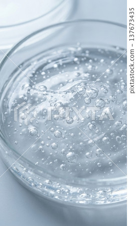 Transparent Hyaluronic Hair Serum Gel with Suspended Bubbles Macro Transparent Hyaluronic Hair Serum Gel with Suspended Bubbles Macro 137673435