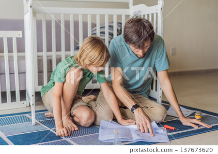 Father and older brother assembling a baby crib at home, preparing for a newborn arrival. Warm family moment full of care and anticipation. Parenthood, sibling bond and home preparation concept Father and older brother assembling a baby crib at home, preparing for a newborn arrival. Warm family moment full of care and anticipation. Parenthood, sibling bond and home preparation concept 137673620