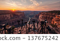 Smartphones and cameras on tripods on the edge of a viewing platform in a picturesque canyon during sunrise. Conceptual ideas for travel blogging, outdoor photography, and influencer culture. 137675242