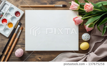 A blank white canvas on a rustic wooden table, with watercolors, flowers, and Easter decor. Concept art, education, DIY creativity, Easter decor. A blank white canvas on a rustic wooden table, with watercolors, flowers, and Easter decor. Concept art, education, DIY creativity, Easter decor. 137675258