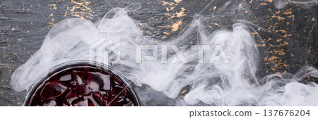 Smoky red cocktail banner with ice Smoky red cocktail banner with ice 137676204