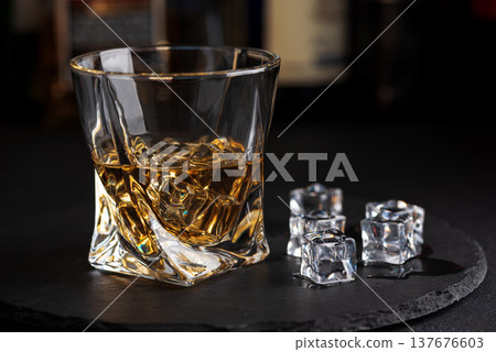 Whiskey Glass with Ice. Sophisticated Bar Ambience Whiskey Glass with Ice. Sophisticated Bar Ambience 137676603