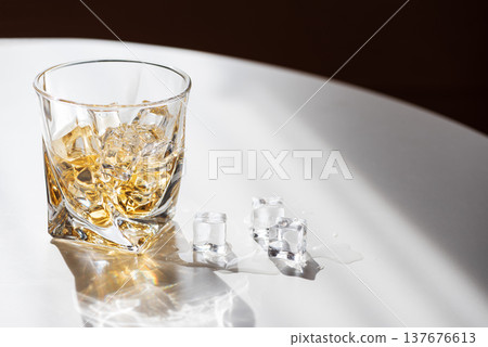Whiskey Glass with Ice. Sophisticated Bar Ambience 137676613