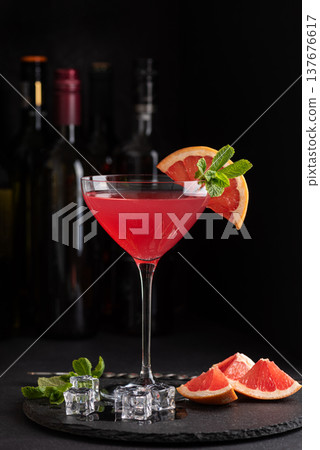 Martini Fiero Cocktail with Grapefruit and Mint. Elegant Mixology Scene 137676617