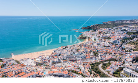 Visitors explore Albufeira marina in Algarve, Portugal Visitors explore Albufeira marina in Algarve, Portugal 137676858