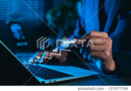 Business Growth and Success Strategy Concept. Businessman points at target icon at top of staircase, step-by-step strategy, and achieving goals. goal setting, strategic planning, business ventures, 137677196