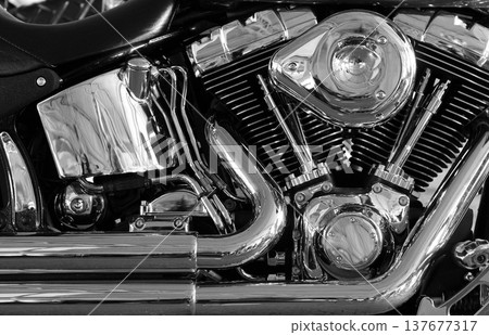 Shiny chromium plated v-shaped engine stock photo. Chromium plated v type motorbike engine close up view Shiny chromium plated v-shaped engine stock photo. Chromium plated v type motorbike engine close up view 137677317