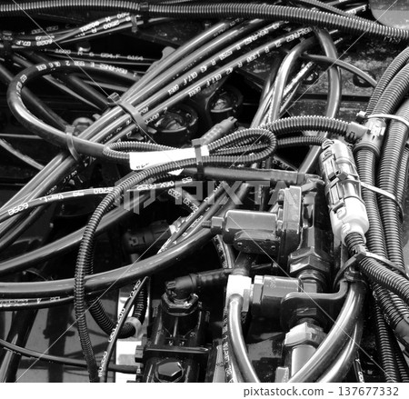 Engine wiring with bundles of isolation tubes, coolant hoses and corrugated pipes Engine wiring with bundles of isolation tubes, coolant hoses and corrugated pipes 137677332