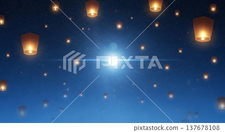 Floating paper lanterns glowing softly on reflective ice at night with starry blue sky background 137678108