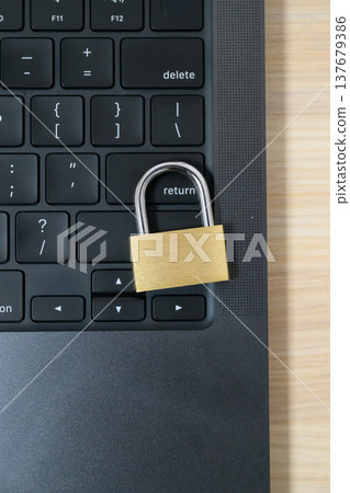 IT security using a padlock on the keyboard IT security using a padlock on the keyboard 137679386