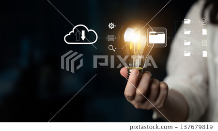 Innovative Concept of Cloud Storage and Illumination with Light Bulb Symbolizing Ideas and Creativity in Digital Transformation Environment Quark 137679819
