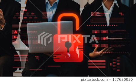 Business professionals discussing cybersecurity solutions with a laptop displaying a digital padlock representing data protection and information security threats.. Raster 137680030
