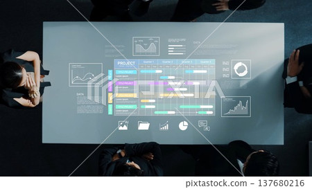 Business Team Collaborating on Project Timeline and Data Analysis with Modern Technology in a Boardroom Setting Gluon Business Team Collaborating on Project Timeline and Data Analysis with Modern Technology in a Boardroom Setting Gluon 137680216