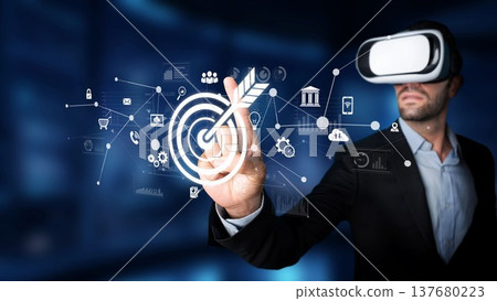 Businessman in Virtual Reality Headset Interacting with Digital Interface and Data Visualization in a High-Tech Environment. Raster 137680223