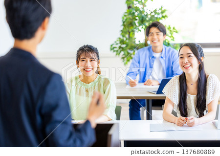 Lecture - The back view of the teacher 137680889