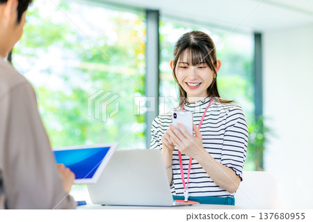 A young woman working in a cafe A young woman working in a cafe 137680955