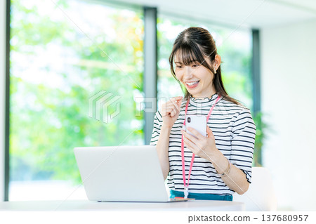 A young woman working in a cafe 137680957