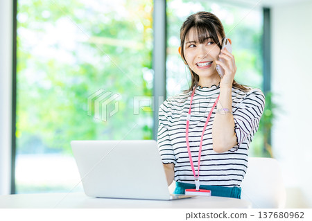 A young woman working on a computer A young woman working on a computer 137680962
