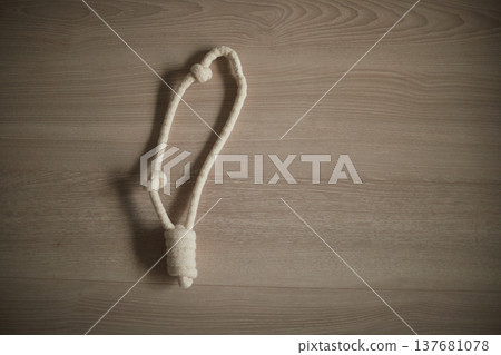 A picture of the rope toy used for dog play in the living room of my house. A picture of the rope toy used for dog play in the living room of my house. 137681078