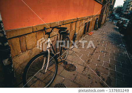 Orange wall and bicycle 137681249